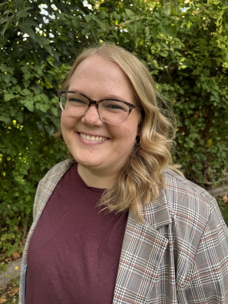 Coach Kaylee Blair, blonde hair and blue eyes